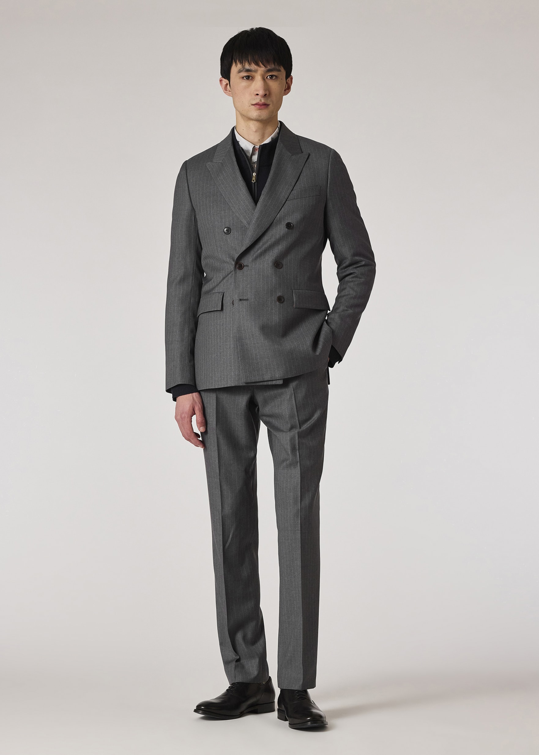 Model View - Tapered-Fit Grey Pinstripe Wool Trousers Paul Smith